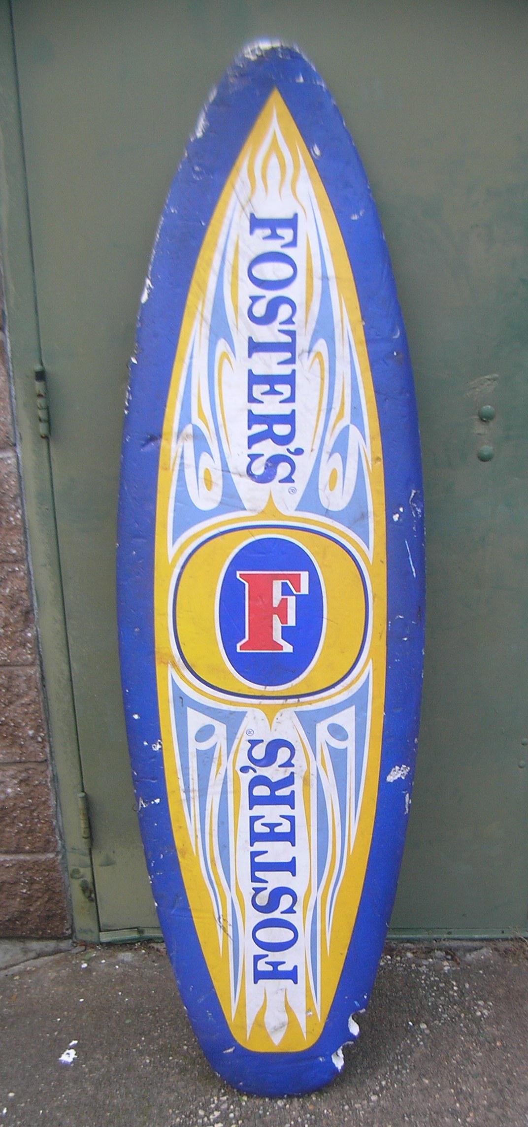 Foster's beer advertising surf board advertising sign: Foster's beer advertising surf board advertising sign 20x68 est. value $100.00-$150.00