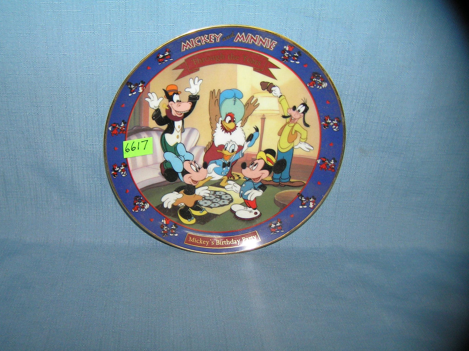 Mickey and Minnie Mouse collector plate: Mickey and Minnie Mouse Mickey's Birthday party collector plate features other Disney characters est. value $25.00-$30.00