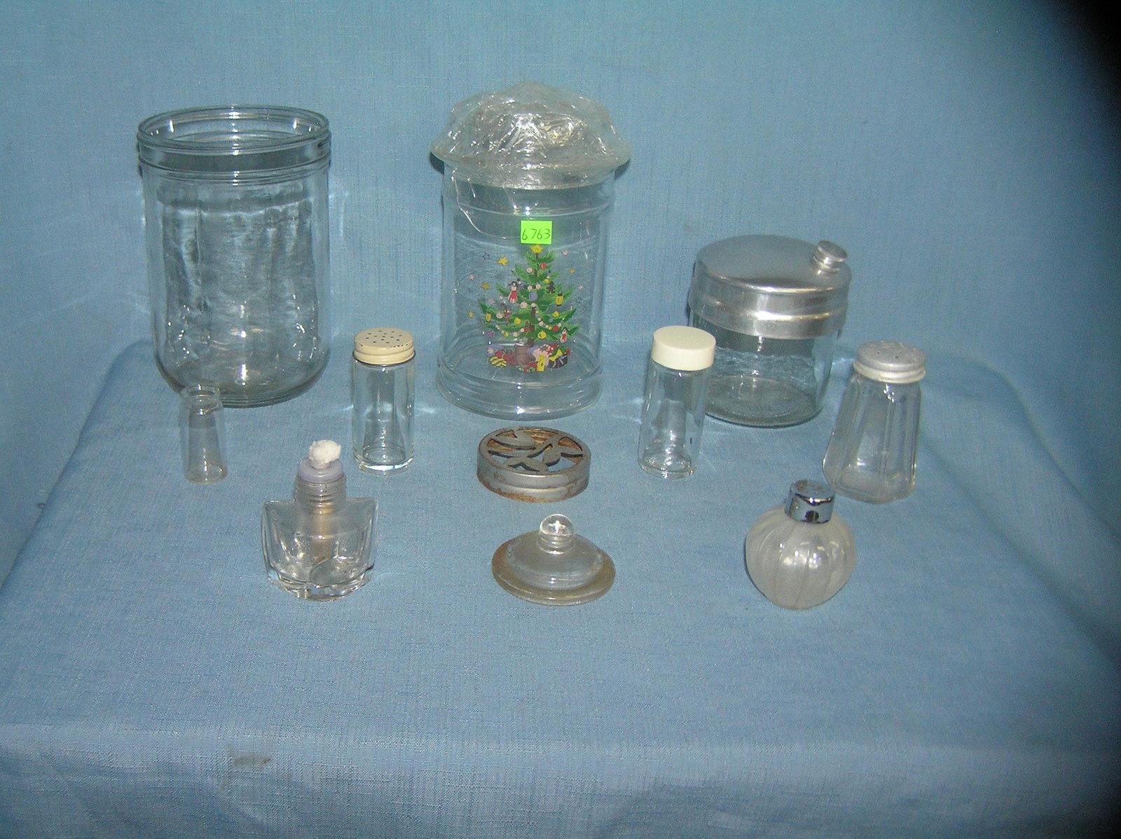 Group of vintage misc. glass bottles and lids: Group of vintage misc. glass bottles and lids condition as found est. value $30.00-$35.00