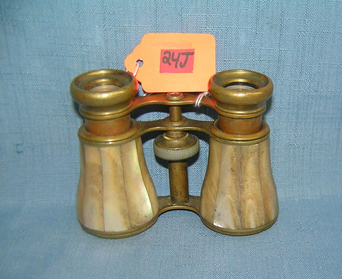 Antique mother of pearl and brass opera glasses: Antique mother of pearl and brass opera glasses est. value $175.00-$200.00