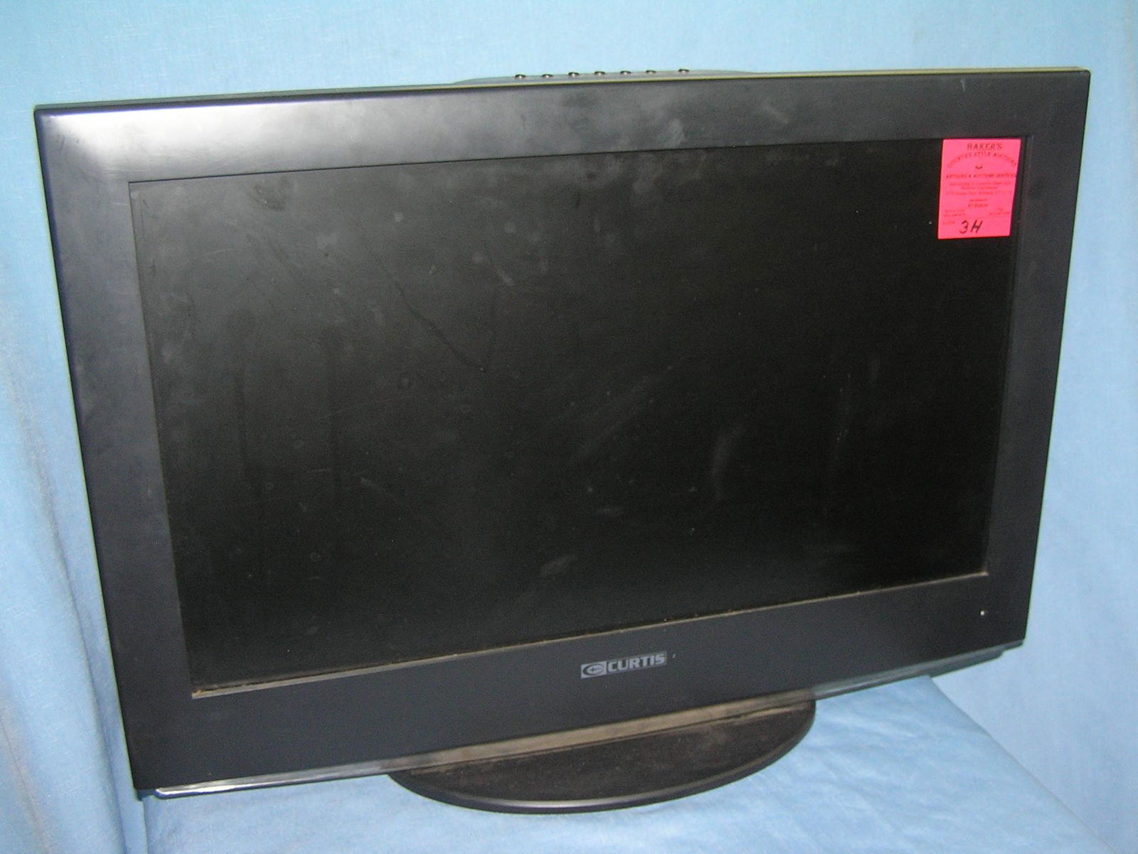 22 inch Curtis flat screen TV: 22 inch Curtis flat screen TV, est. value $50.00-$75.00 moving and storage co. seized merchandise