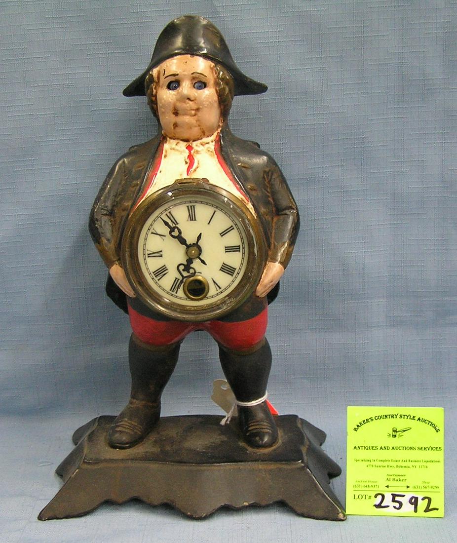 Cast iron continental man blinking eye clock: Hand painted cast iron continental man blinking eye clock est. value $500.00-$600.00