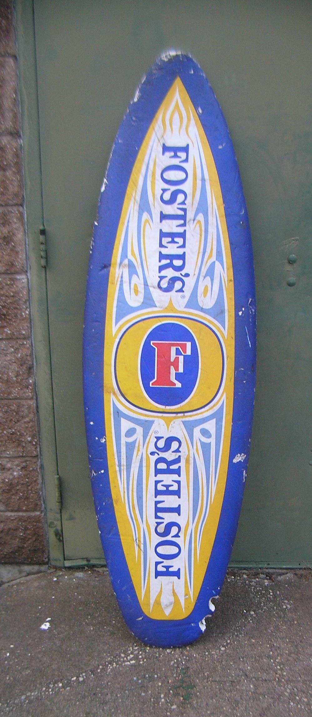 Foster's beer advertising surf board advertising sign: Foster's beer advertising surf board advertising sign 20x68 est. value $100.00-$150.00