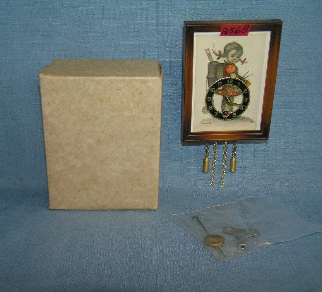 Goebel Hummel windup German clock: Goebel Hummel windup German clock mint never used with key, pendulum and original box est. value $100.00-$125.00