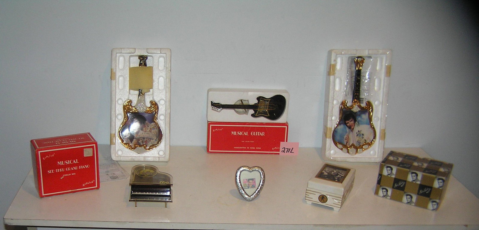 Collection of vintage Elvis Presley collectibles: Collection of vintage Elvis Presley collectibles includes musical guitar, piano trinket box and more est. value $200.00-$250.00