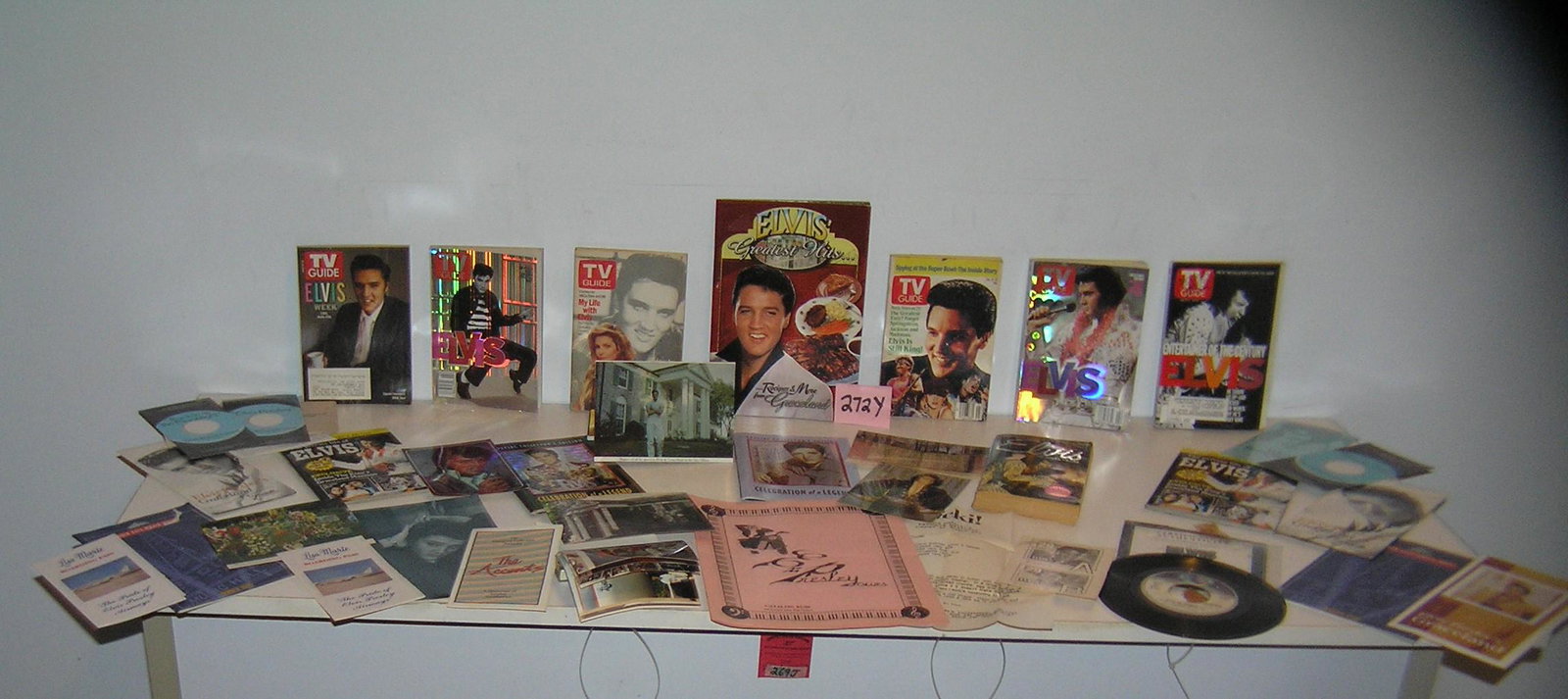 Collection of Elvis Presley collectibles and ephemera: Large collection of Elvis Presley collectibles and ephemera includes photos, TV Guides, magazines and more est. value $200.00-$225.00
