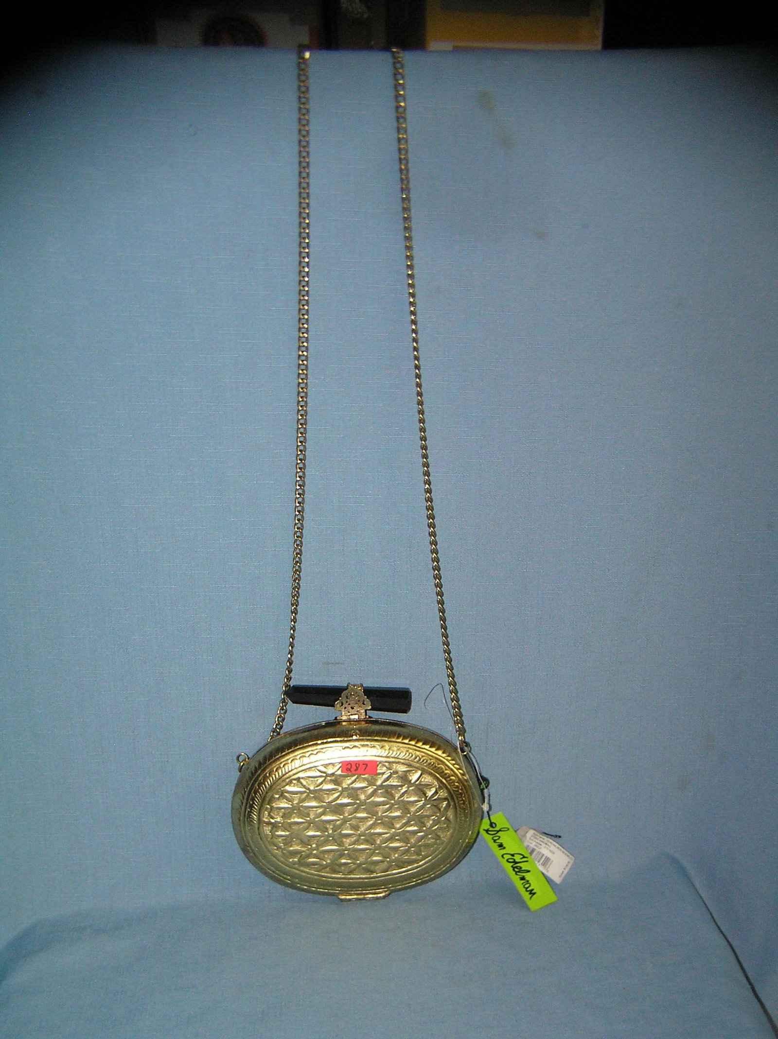 Gold toned designer signed hand bag: Gold toned designer signed hand bag. Marked inside Sam Edelman with original string tags all gold toned design retail $128.00 est. value $128.00-$138.00