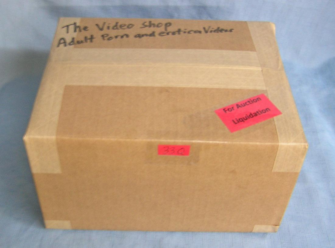 Moving and Storage Company mystery box lot: Moving and Storage Company mystery box lot marked The Video shop: contents: adult porn and erotica videos part of a moving and storage company seized or unclaimed merchandise group sent to auction for