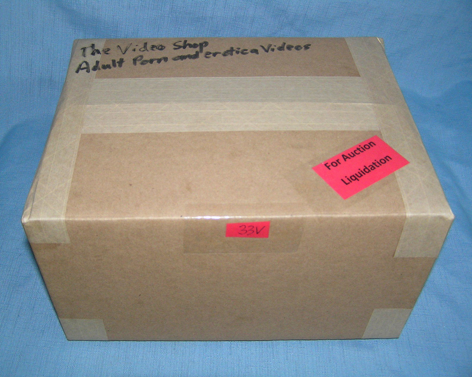 Moving and Storage Company mystery box lot marked The: Moving and Storage Company mystery box lot marked The Video shop: contents: adult porn and erotica videos part of a moving and storage company seized or unclaimed merchandise group sent to auction for