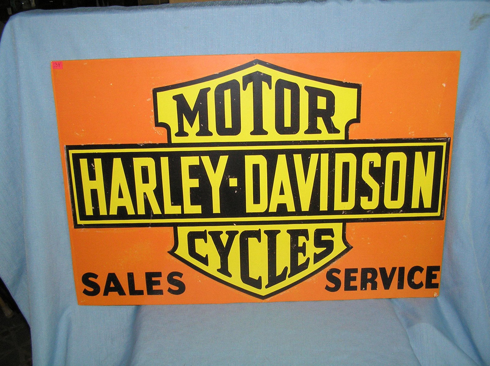 Harley Davidson motorcycle sales and service retro: Harley Davidson motorcycle sales and service retro style advertising sign large 20 inches by 30 inches printed on masonite board est. value $200.00-$250.00