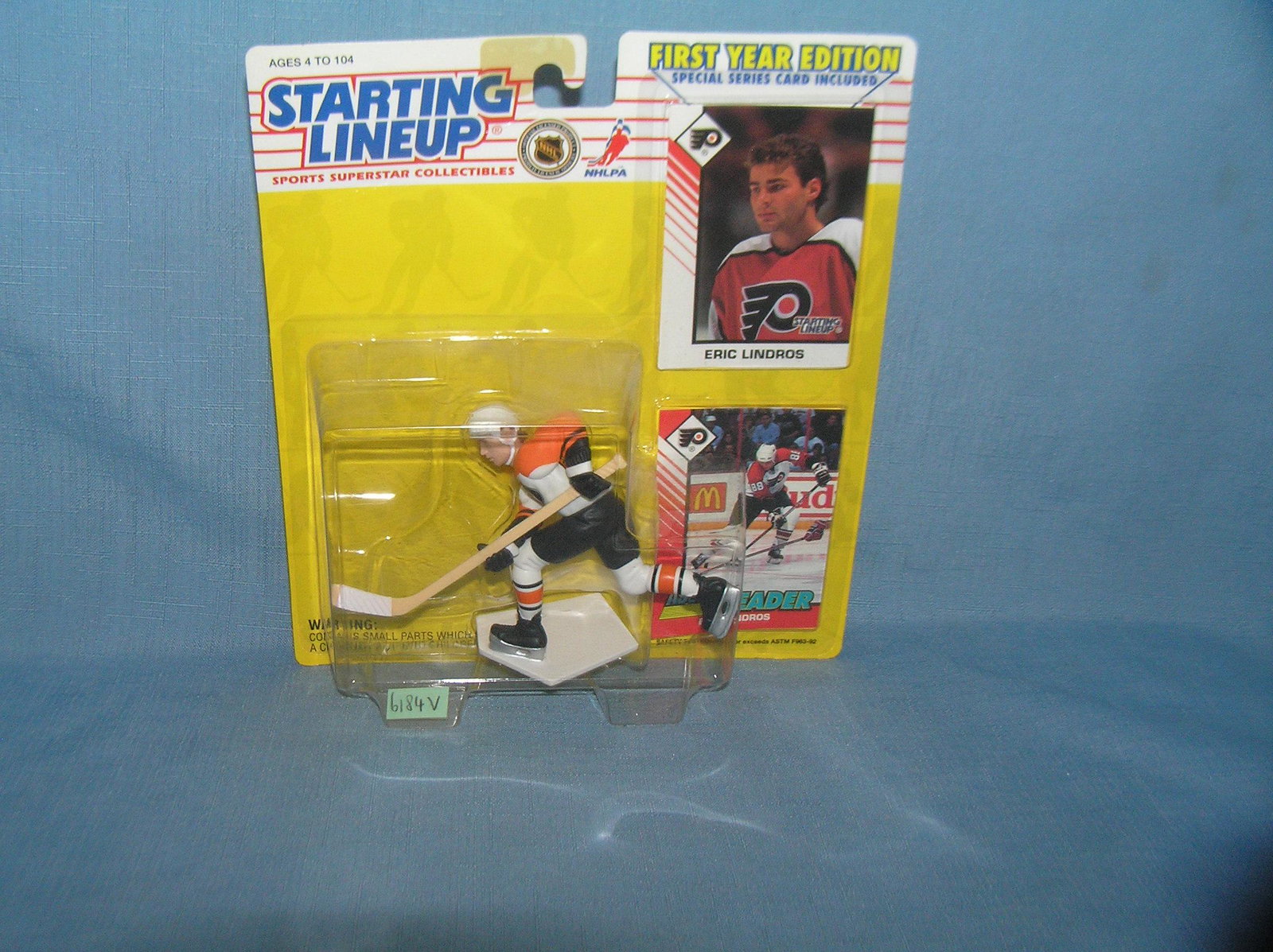 Eric Lindros hockey figure and sport card: Eric Lindros hockey figure and sport card mint on card est. value $25.00-$30.00