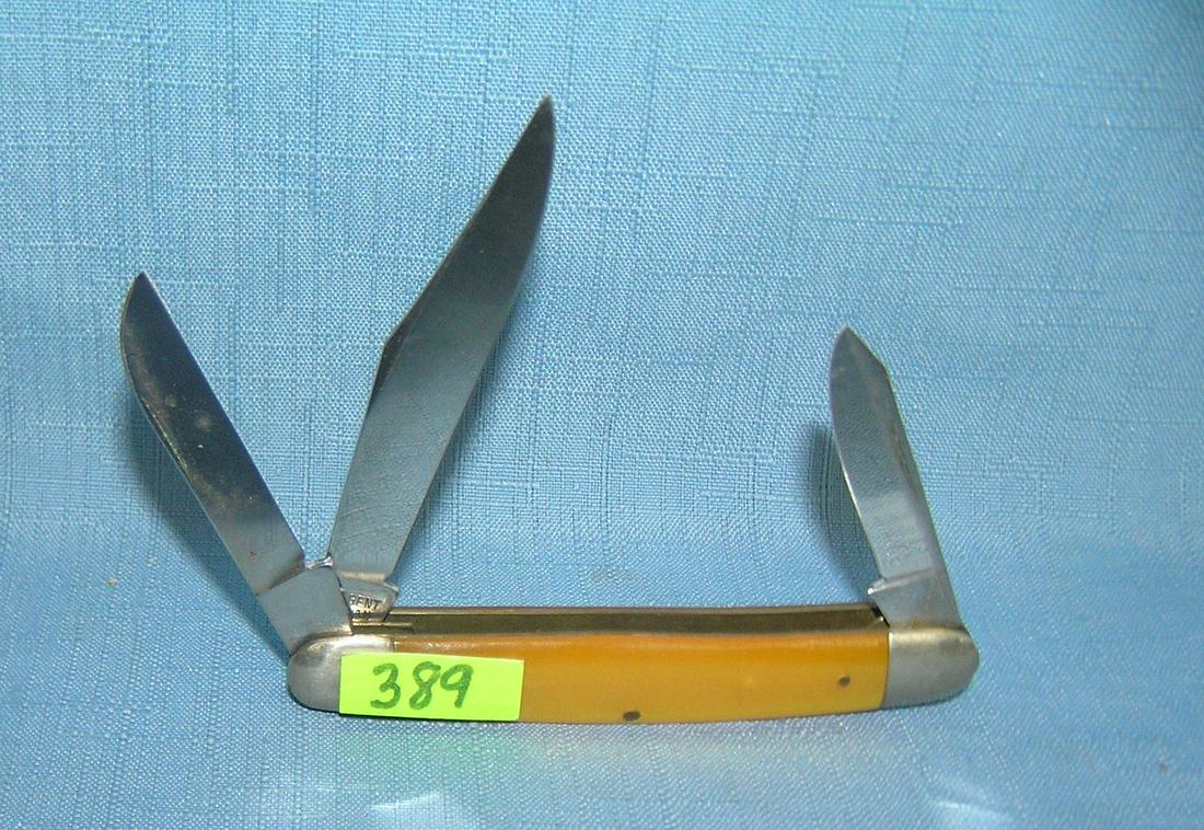 Vint 3 bladed pocket knife with yellow amber style: Vint 3 bladed pocket knife with yellow amber style handle mint old dealer store stock circa 1950's est. value $65.00-$75.00