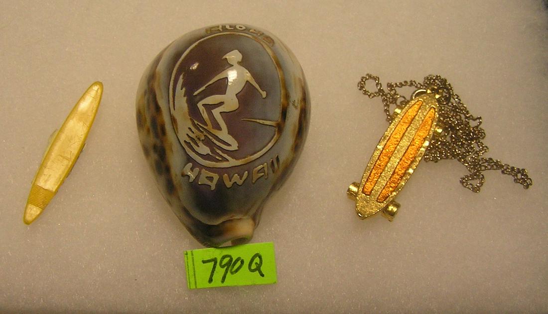 Group of surfing and skateboarding collectibles: Group of surfing and skateboarding collectibles includes a carved Hawaiian sea shell, 1968 plastic Hot wheels surf board and a skate board necklace est. value $50.00-$65.00