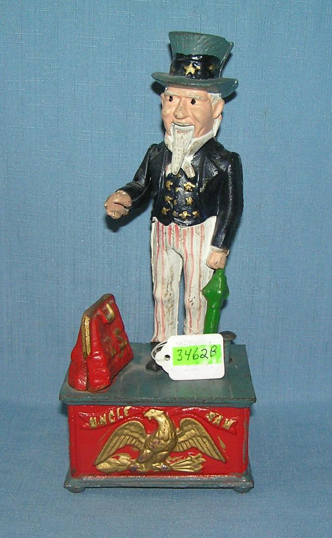 Vintage Uncle Sam mechanical bank: Vintage hand painted cast iron Uncle Sam mechanical bank est. value $300.00-$350.00
