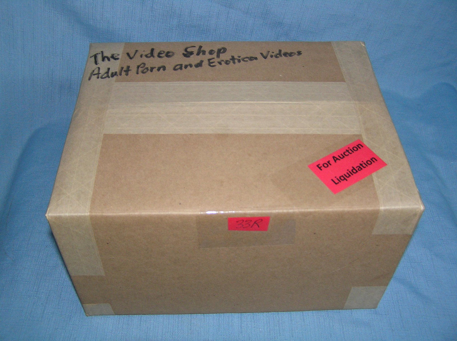 Moving and Storage Company mystery box lot marked The: Moving and Storage Company mystery box lot marked The Video shop: contents: adult porn and erotica videos part of a moving and storage company seized or unclaimed merchandise group sent to auction for