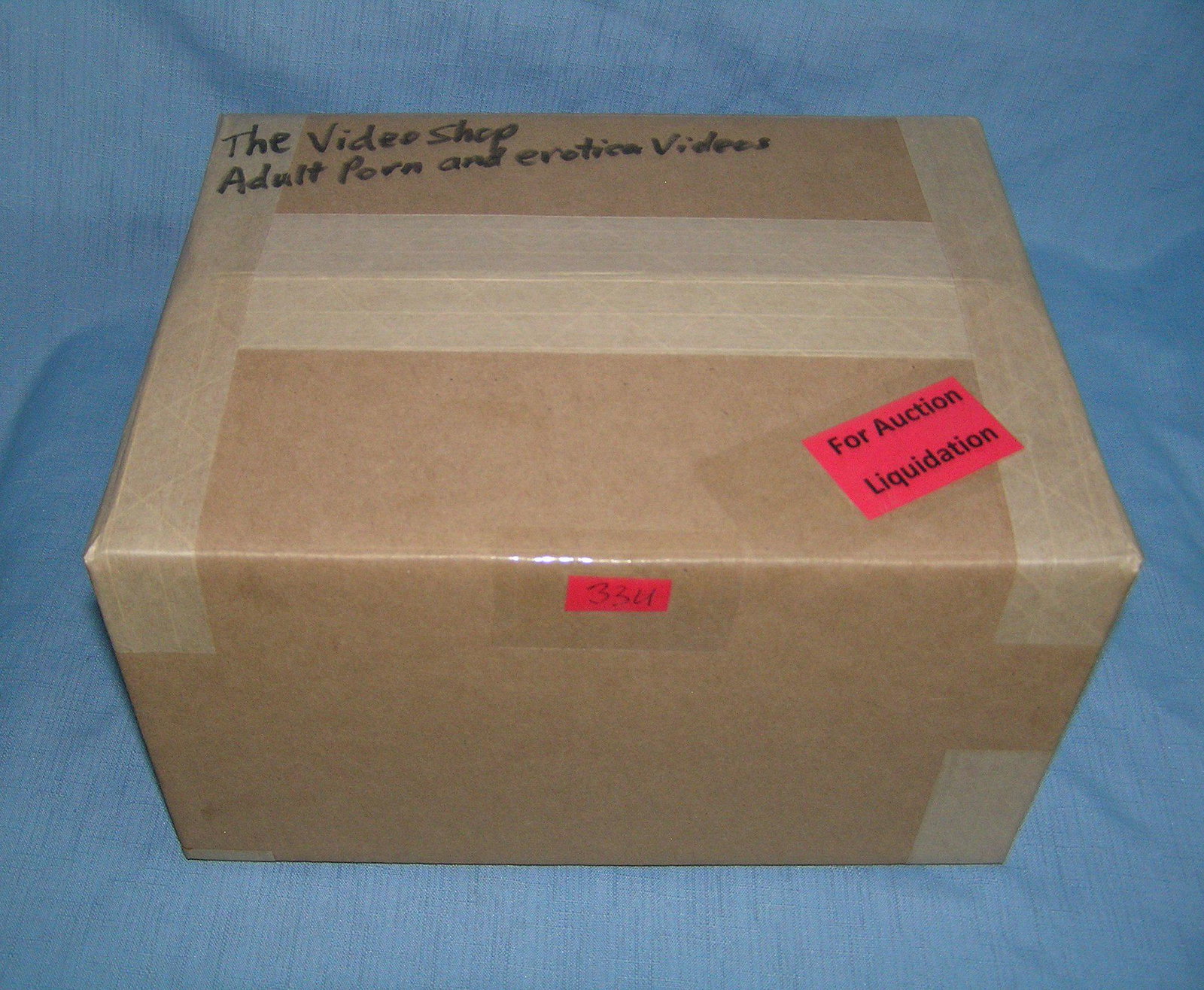 Moving and Storage Company mystery box lot marked The: Moving and Storage Company mystery box lot marked The Video shop: contents: adult porn and erotica videos part of a moving and storage company seized or unclaimed merchandise group sent to auction for
