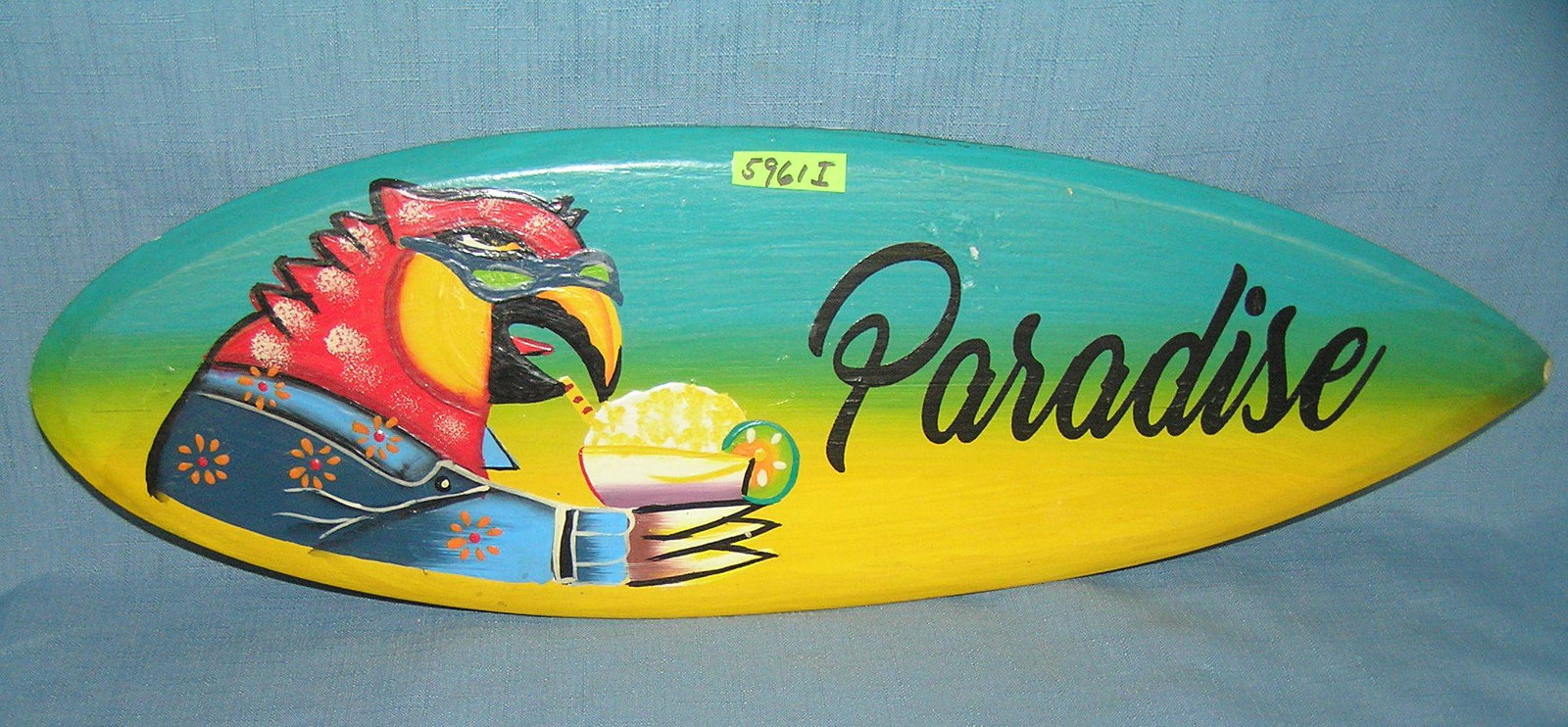 Jimmy Buffet style decorative wood display sign: Jimmy Buffet style decorative wood display sign surfboard shaped hand painted est. value $35.00-$40.00