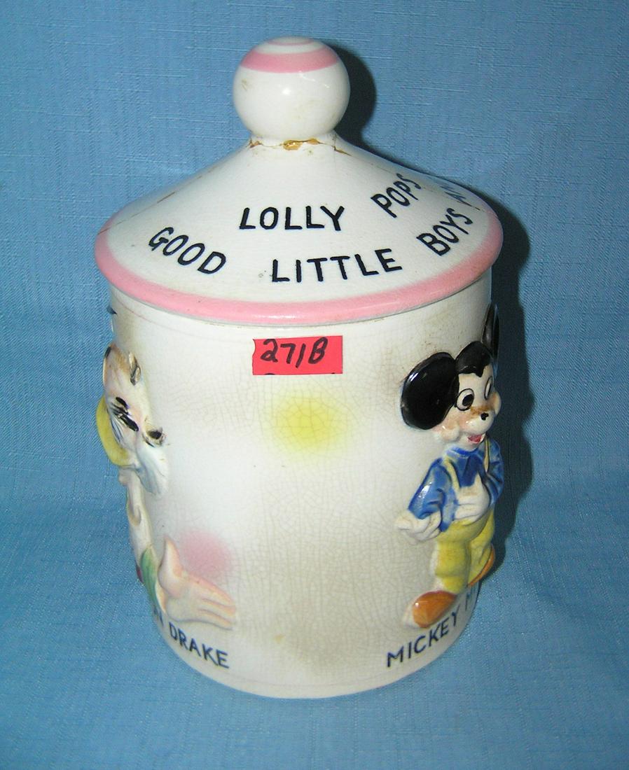 Early Disney lolly pop jar dated 1961: Early Walt Disney Prductions Mickey Mouse, Donald Duck and Ludwig von Drake lolly pop jar with lid, dated on base 1961 condition as found top is complete but reglued est. value $80.00-$100.00