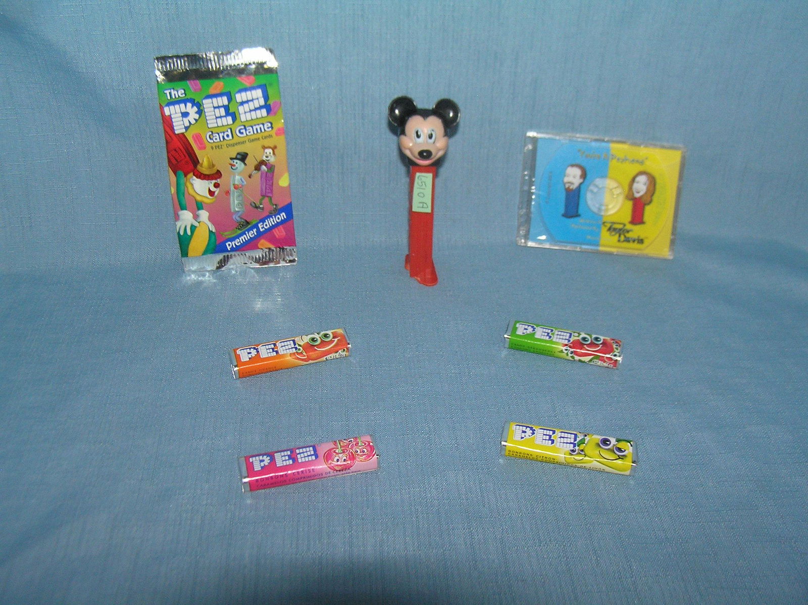 PEZ Candy containers, candy and collectibles: PEZ Candy containers, candy and collectibles ( Bottom of Mickey as found, damaged ) est. value $25.00-$30.00