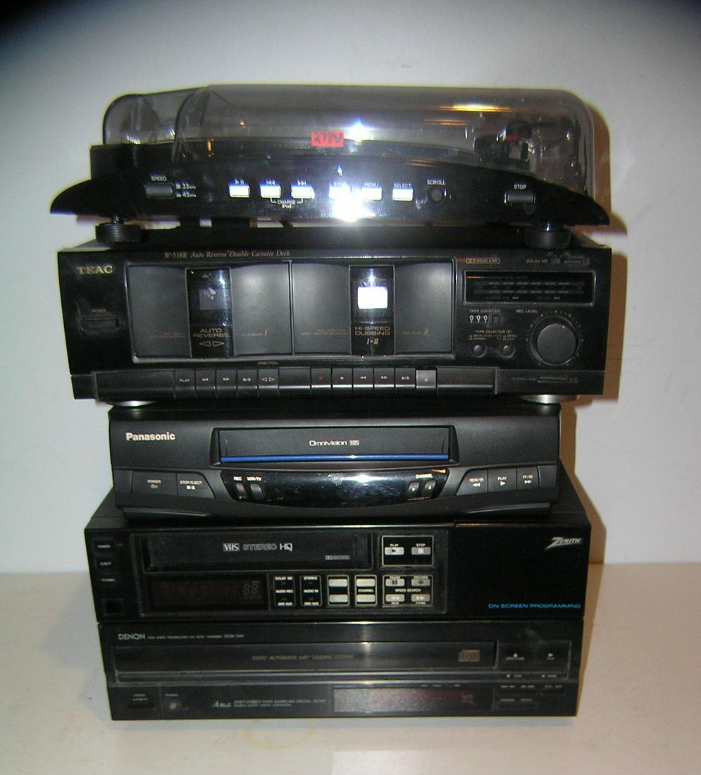 Group of modern electronics: Group of modern electronics includes Ion I Profile turn table, Teac auto reverse double cassette deck, Denon automatic disc loading system, Zenith onscreen programing VHS stereo an dPan asonic omnivis