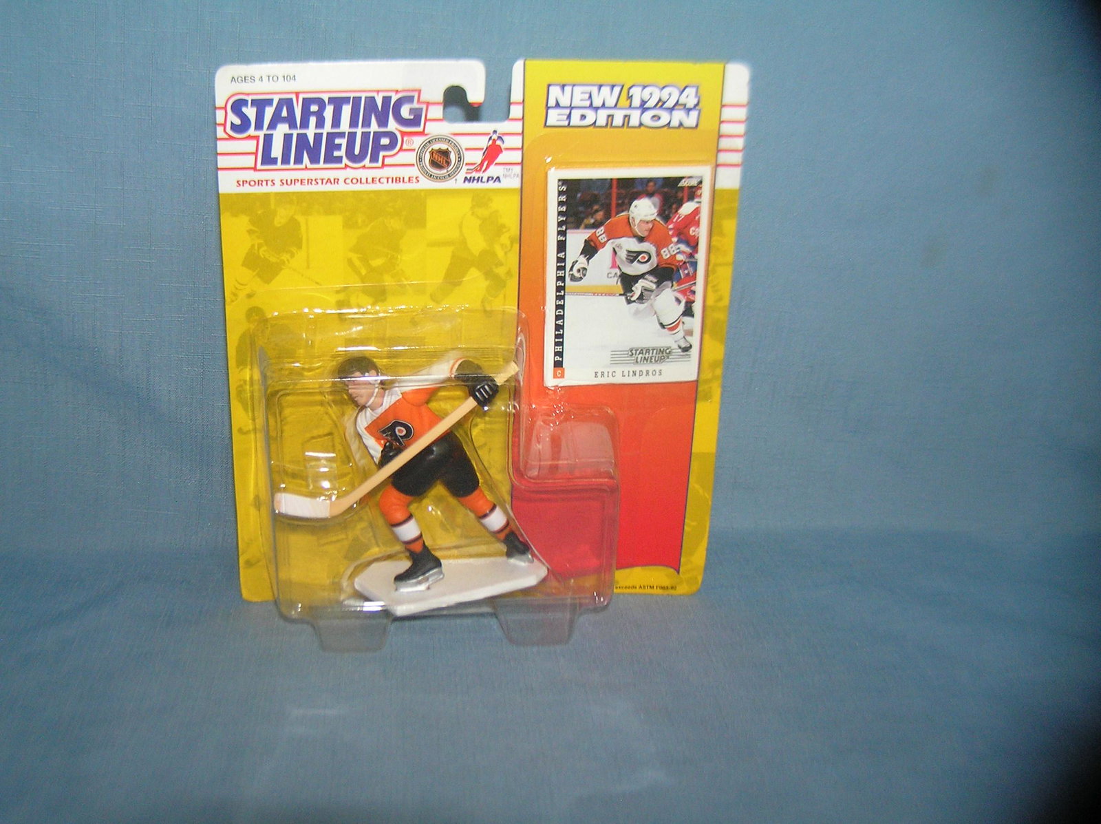 Eric Lindros hockey figure and sport card: Eric Lindros hockey figure and sport card mint on card est. value $25.00-$30.00