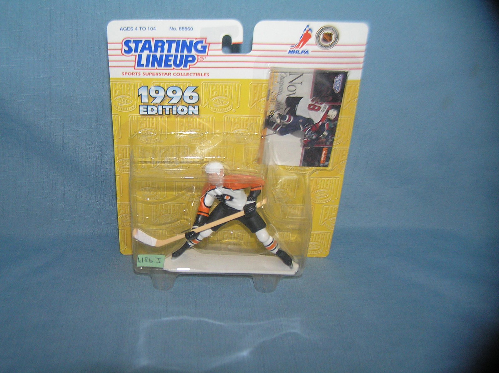 Eric Lindros hockey figure and sport card: Eric Lindros hockey figure and sport card mint on card est. value $25.00-$30.00