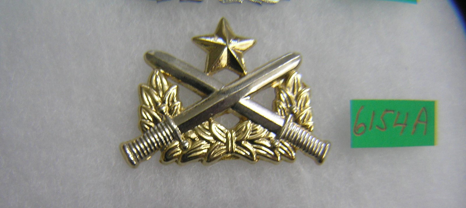Military badge with crossed bayonets: Military badge with crossed bayonets est. value $30.00-$35.00