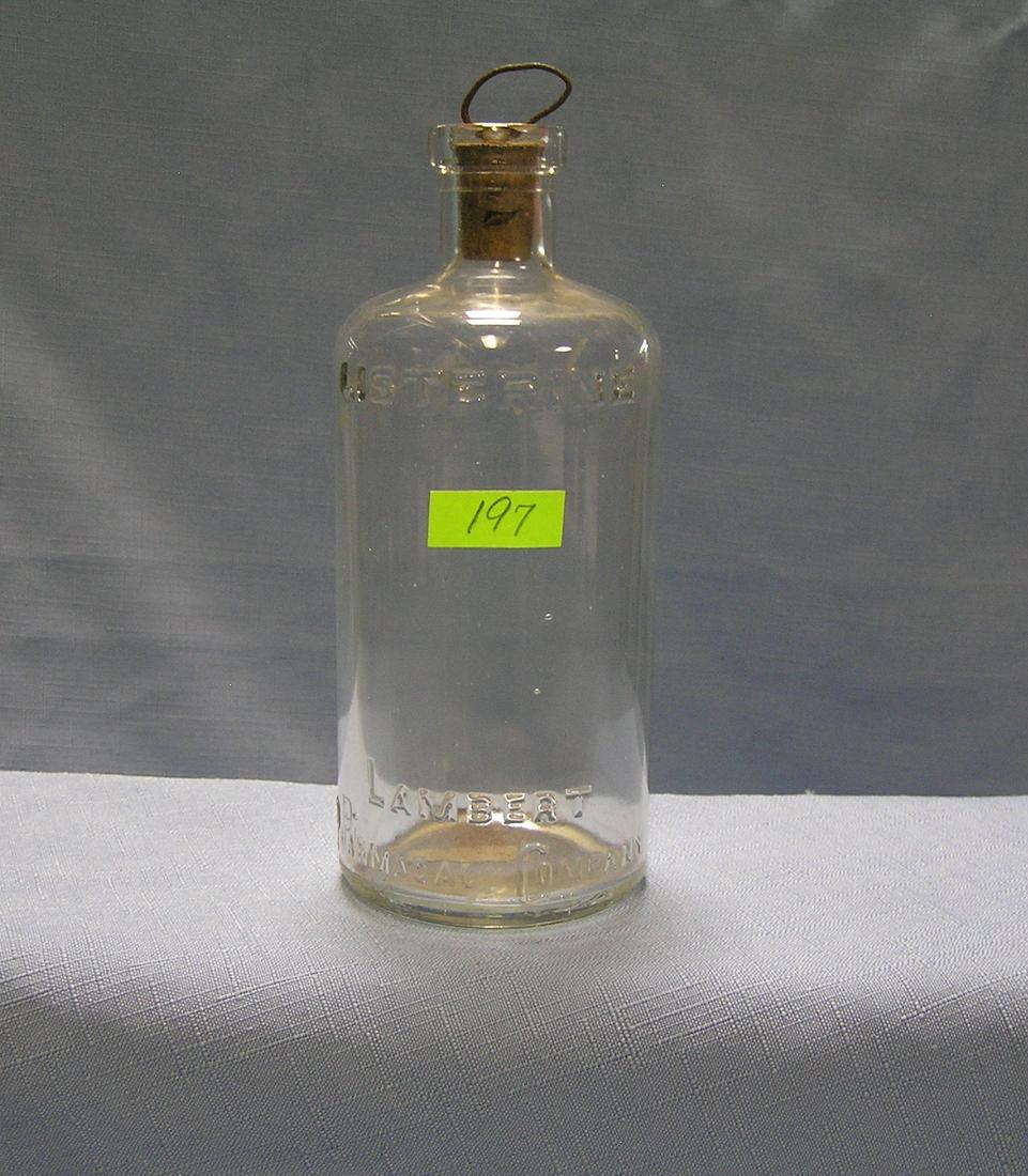 Antique Listerine glass bottle: Antique Listerine glass bottle with cork and metal stopper est. value $40.00-$50.00