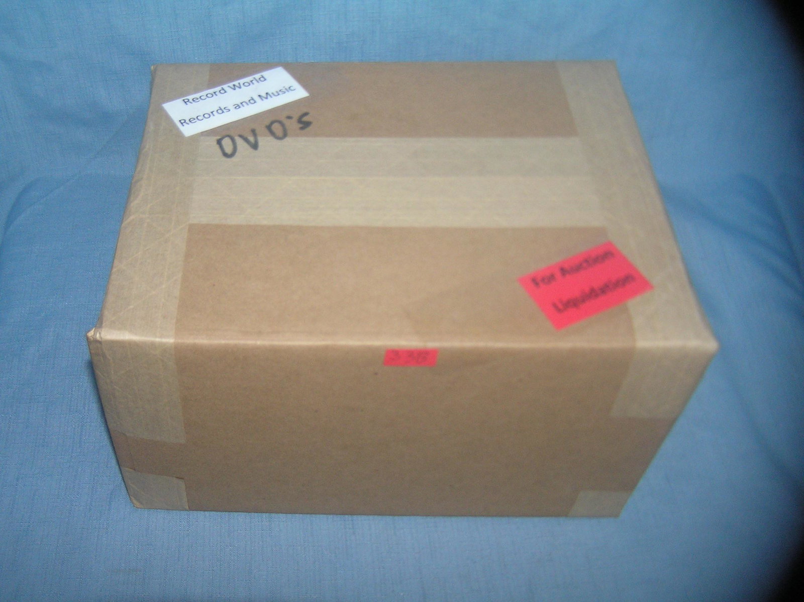 Moving and Storage Company mystery box lot: Moving and Storage Company mystery box lot marked Record World records and music: DVD'S part of a moving and storage company seized or unclaimed merchandise group sent to auction for liquidation est. 