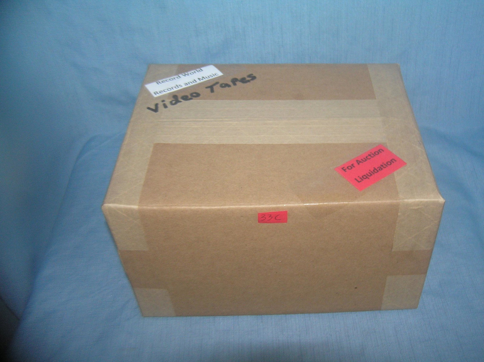 Moving and Storage Company mystery box lot: Moving and Storage Company mystery box lot marked Record World records and music video tapes part of a moving and storage company seized or unclaimed merchandise group sent to auction for liquidation 