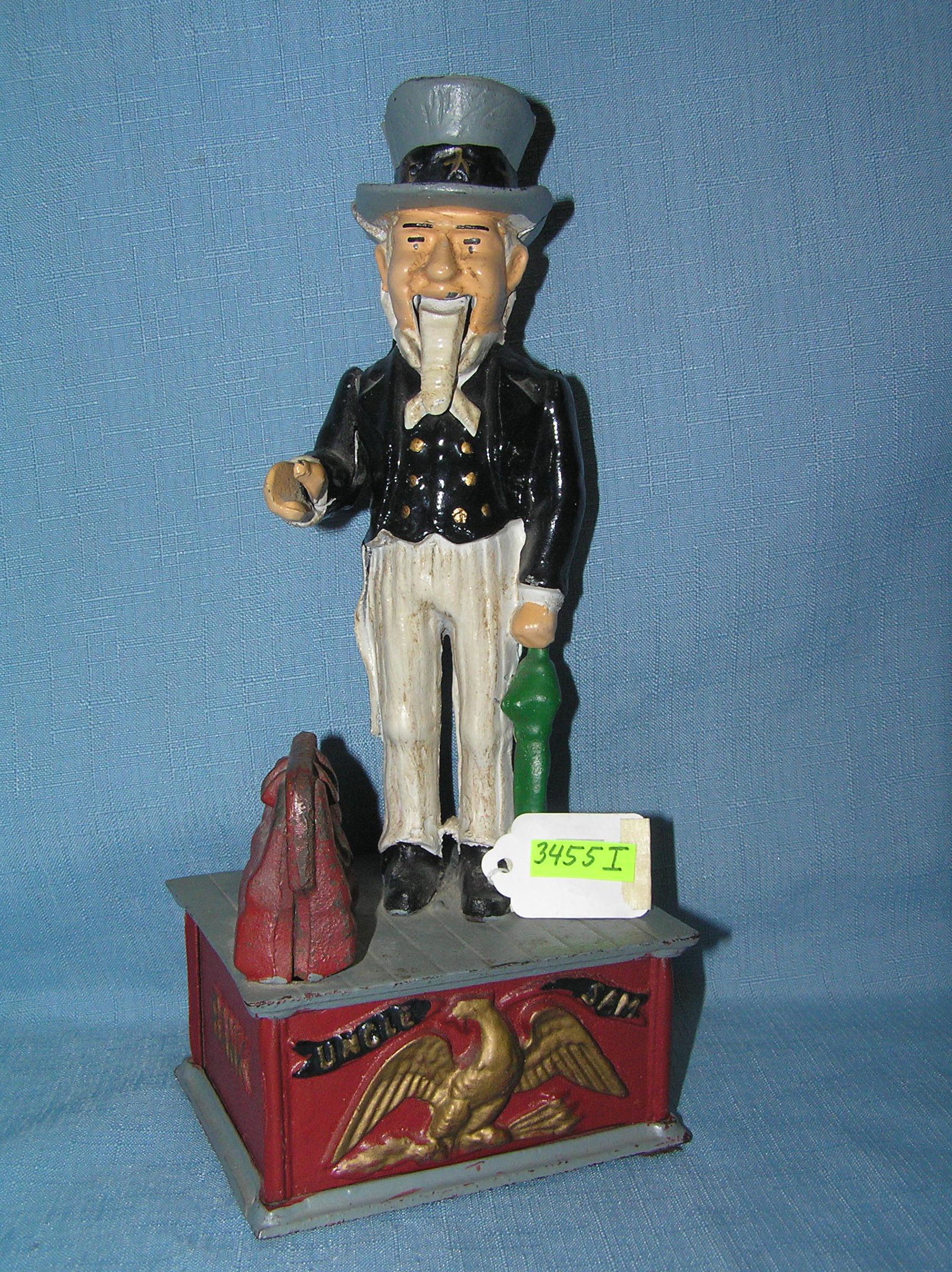 Uncle Sam cast iron mechanical bank: Uncle Sam hand painted and cast iron mechanical bank circa 1960's est. value $250.00-$275.00