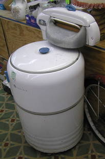 Antique GE washing machine circa 1930's: Antique GE washing machine with wooden automatic wringer circa 1930’s est. value $500.00-$600.00