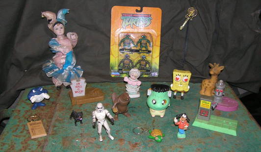 Collection of action figures: Collection of action figures includes Star Wars Storm Trooper, Teenage Mutant Ninja Turtles mint on card, Sponge Bob, Disney and more est. value $80.00-$100.00