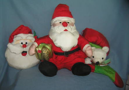 Group of 3 modern holiday decorations: Group of 3 modern holiday decorations includes a pair of Santa figures and a bear decorated stocking with bell est. value $40.00-$50.00