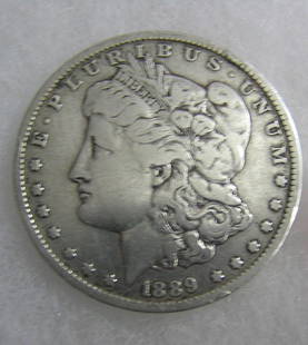 1889O Morgan silver dollar fine condition: 1889O Morgan silver dollar fine condition est. value $90.00-$100.00
