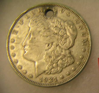 1921 Morgan silver dollar with necklace loop on top: 1921 Morgan silver dollar with necklace loop on top in good condition est. value $50.00-$60.00