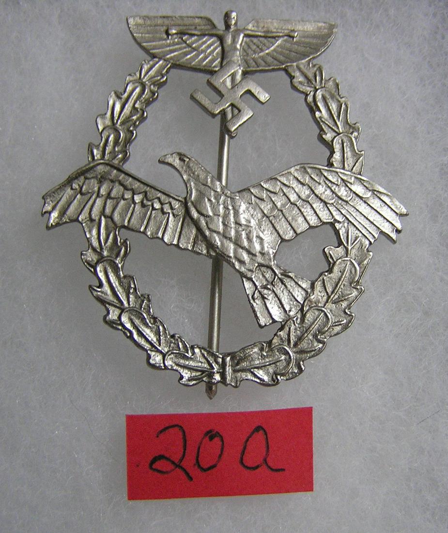 German N.S.F.K. pilot's badge silver color WWII style: German N.S.F.K. pilot's badge silver color WWII style high quality reproduction collectors, re-enactors,historical or theatrical collectors piece est. value $65.00-$75.00