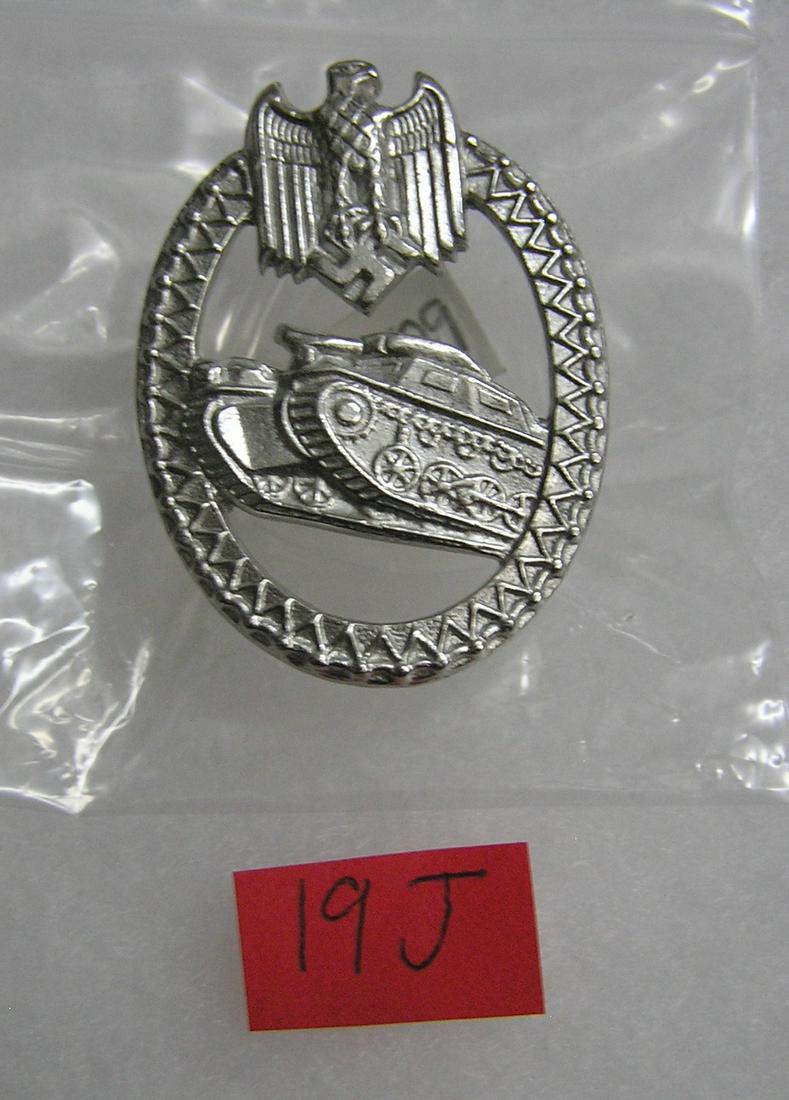 German Panzer marksmanship badge WWII style: German Panzer marksmanship badge silver color WWII style high quality reproduction collectors, re-enactors,historical or theatrical collectors piece est. value $50.00-$60.00