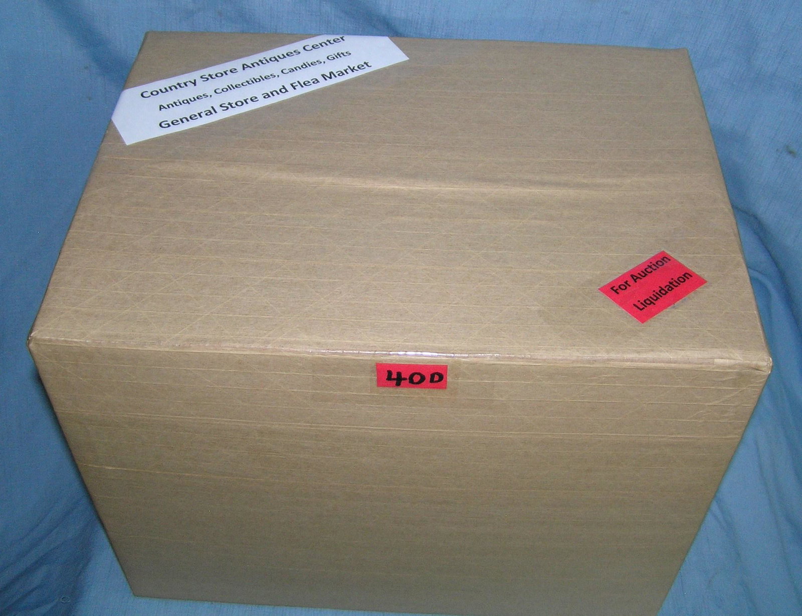Moving and Storage Company mystery box lot: Moving and Storage Company mystery box lot marked Country Store Antiques Center: Antiques, Collectibles, Candies, Gifts, General Store and Flea Market part of a moving and storage company seized or un