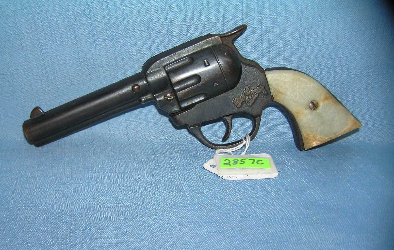 Early Gene Autry all cast iron cap gun: Early Gene Autry all cast iron cap gun with great pearl style handle est. value $175.00-$200.00