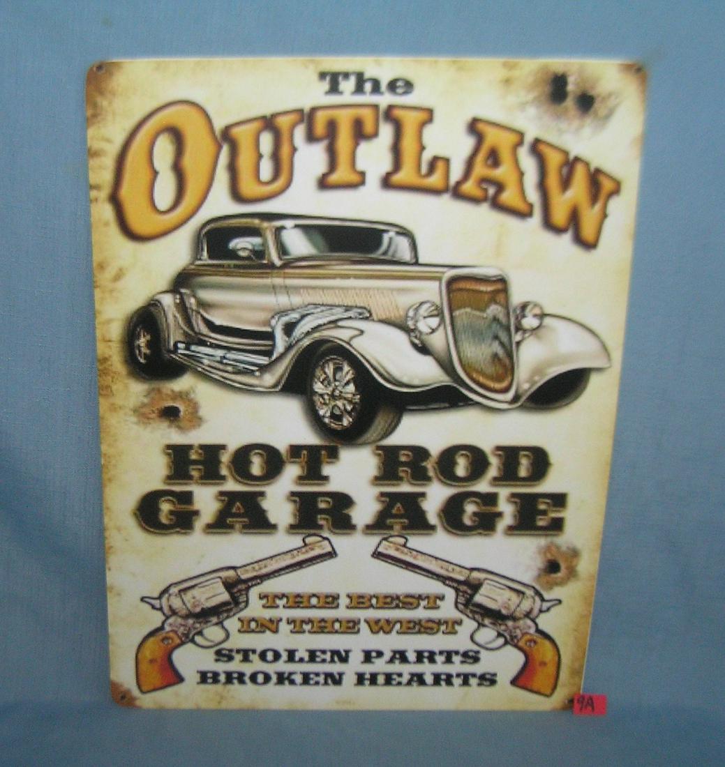 The Outlaw Hot Rod Garage retro style sign: The Outlaw Hot Rod Garage 12 by 16 inches retro style advertising sign printed on PVC hard board these signs are auctioned for there decorative and display purposes est. value $45.00-$60.00