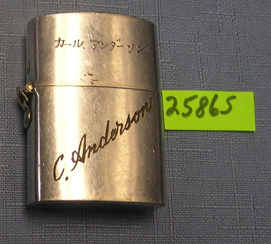 Occupied Japan souvenir cigarette lighter: Vintage early post WWII Occupied Japan souvenir cigarette lighter marked Ginza Tokyo Japan from Maruhachi Silk Co. dated 1951 and bearing the US serviceman's name C. Anderson, chrome over brass est. v