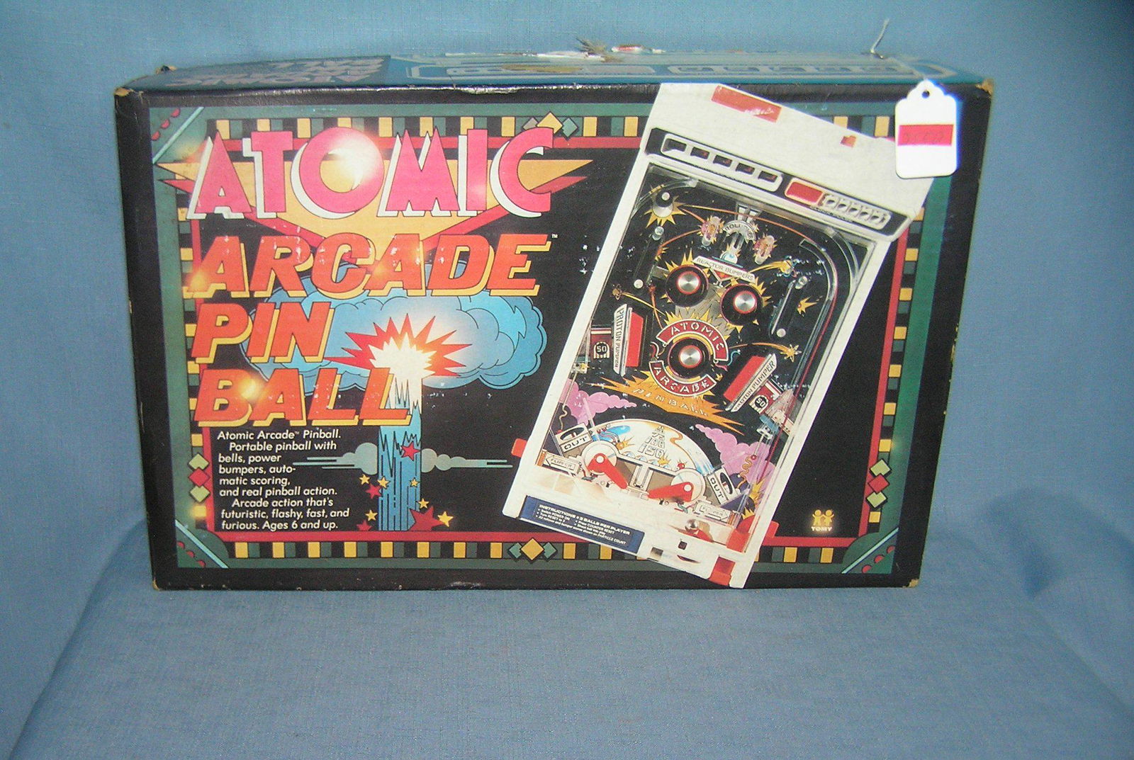 Atomic arcade pin ball game: Atomic arcade pin ball game battery operated with original box by Tomey Toys est. value $80.00-$100.00