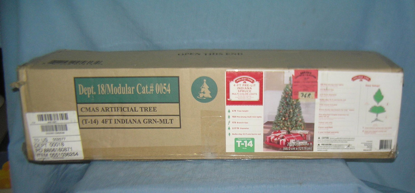 4 foot pre lit Indiana spruce Christmas tree: 4 foot pre lit Indiana spruce Christmas tree with multi colored lights est. value $40.00-$50.00