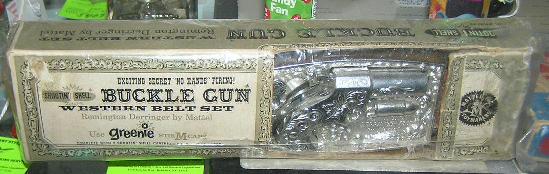Early Mattel buckle gun with western belt in original box: Early Mattel buckle gun with western belt in original box dated 1955 est. value $275.00-$300.00