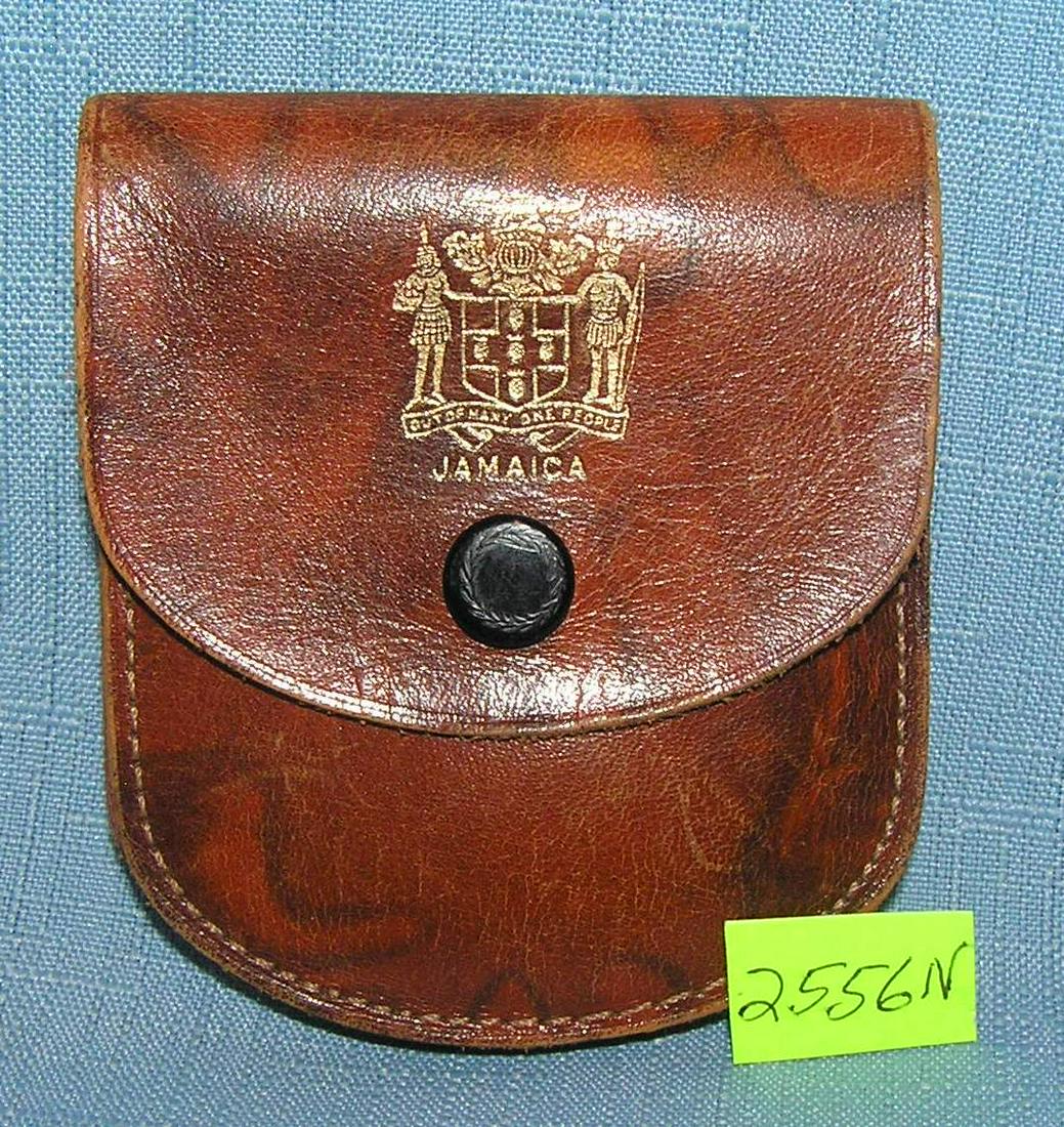 Jamaican police leather pouch: Jamaican police leather pouch with Jamaican code of arms gold printed on front est. value $40.00-$45.00