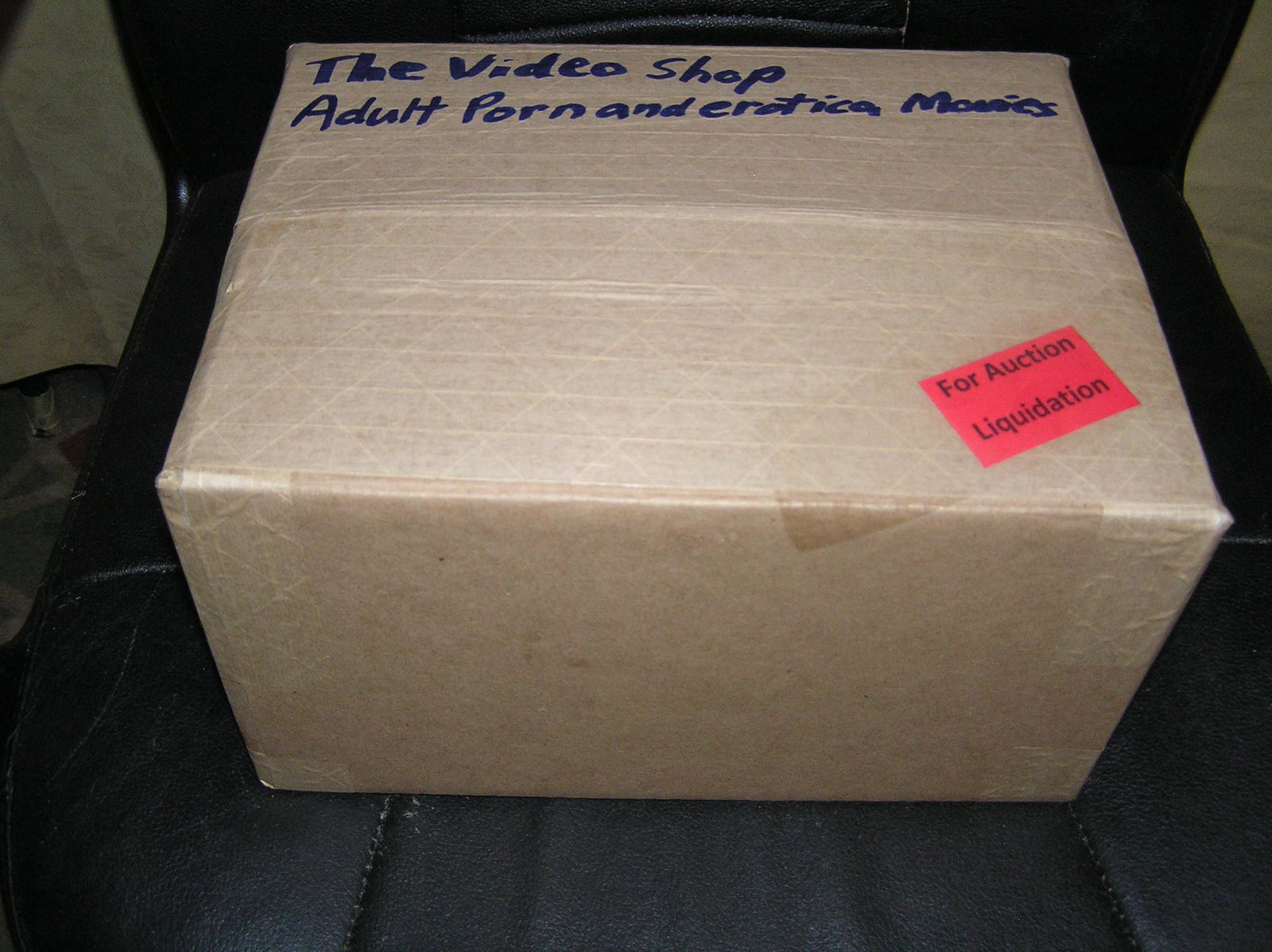Moving and Storage Company mystery box lot marked The Video Shop: Moving and Storage Company mystery box lot marked The Video Shop: Adult Porn and Erotica movies part of a moving and storage company seized or unclaimed merchandise group sent to auction for liquidati