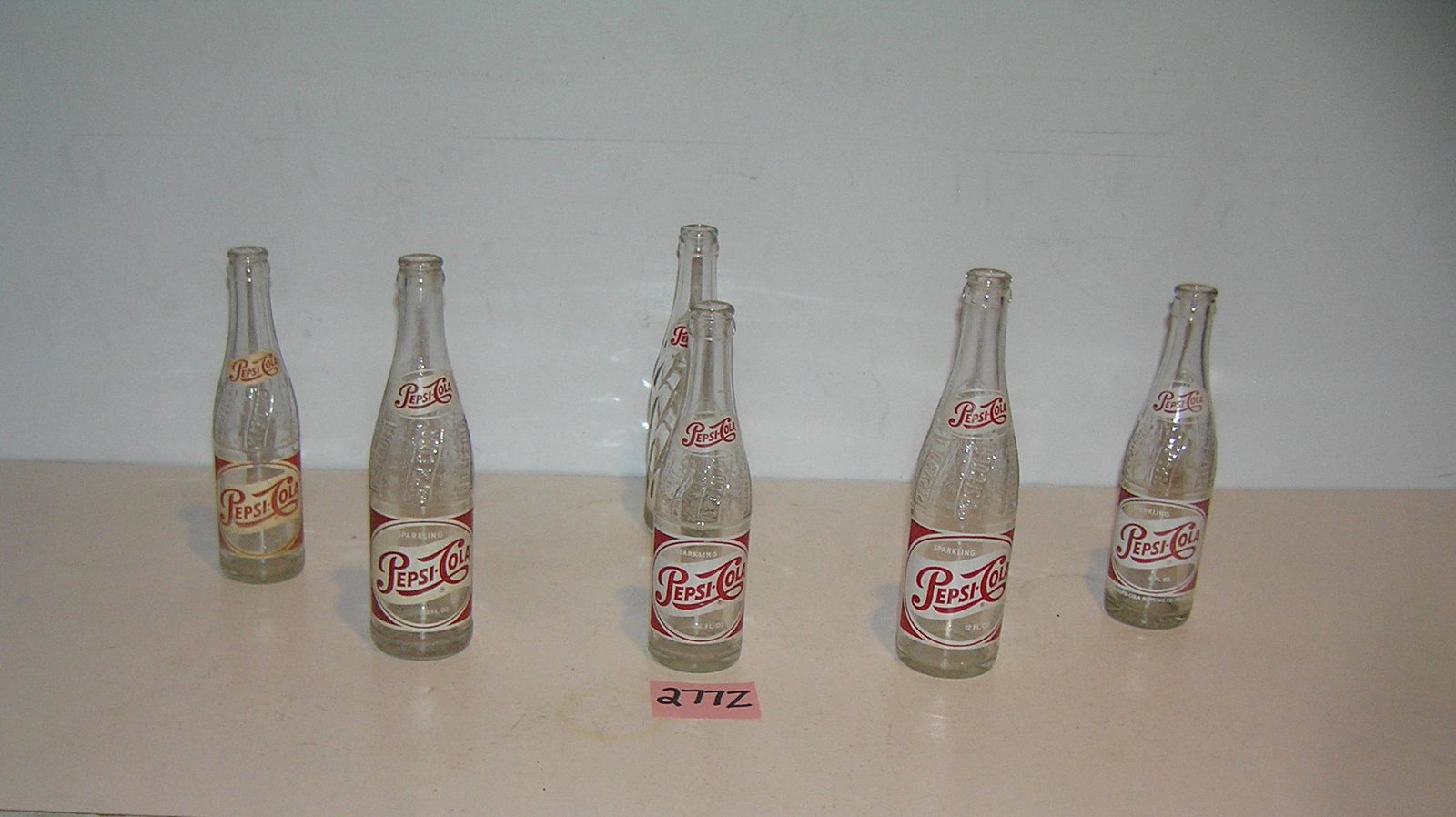 Early Pepsi Cola painted label soda bottles: Collection of early Pepsi Cola painted label soda bottles est. value $65.00-$75.00