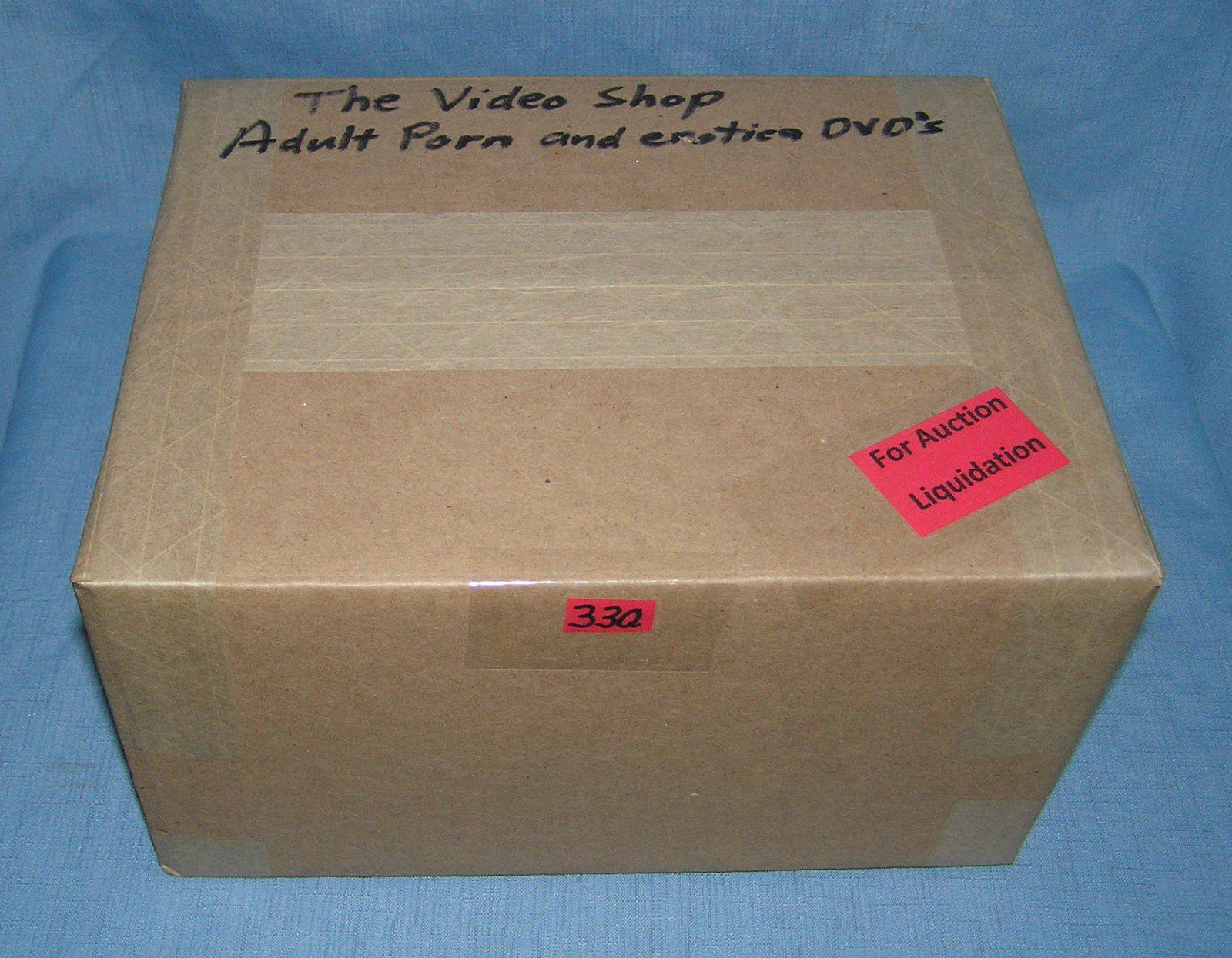 Moving and Storage Company mystery box lot marked The Video Shop: Moving and Storage Company mystery box lot marked The Video Shop: Adult Porn and Erotica Movies part of a moving and storage company seized or unclaimed merchandise group sent to auction for liquidati