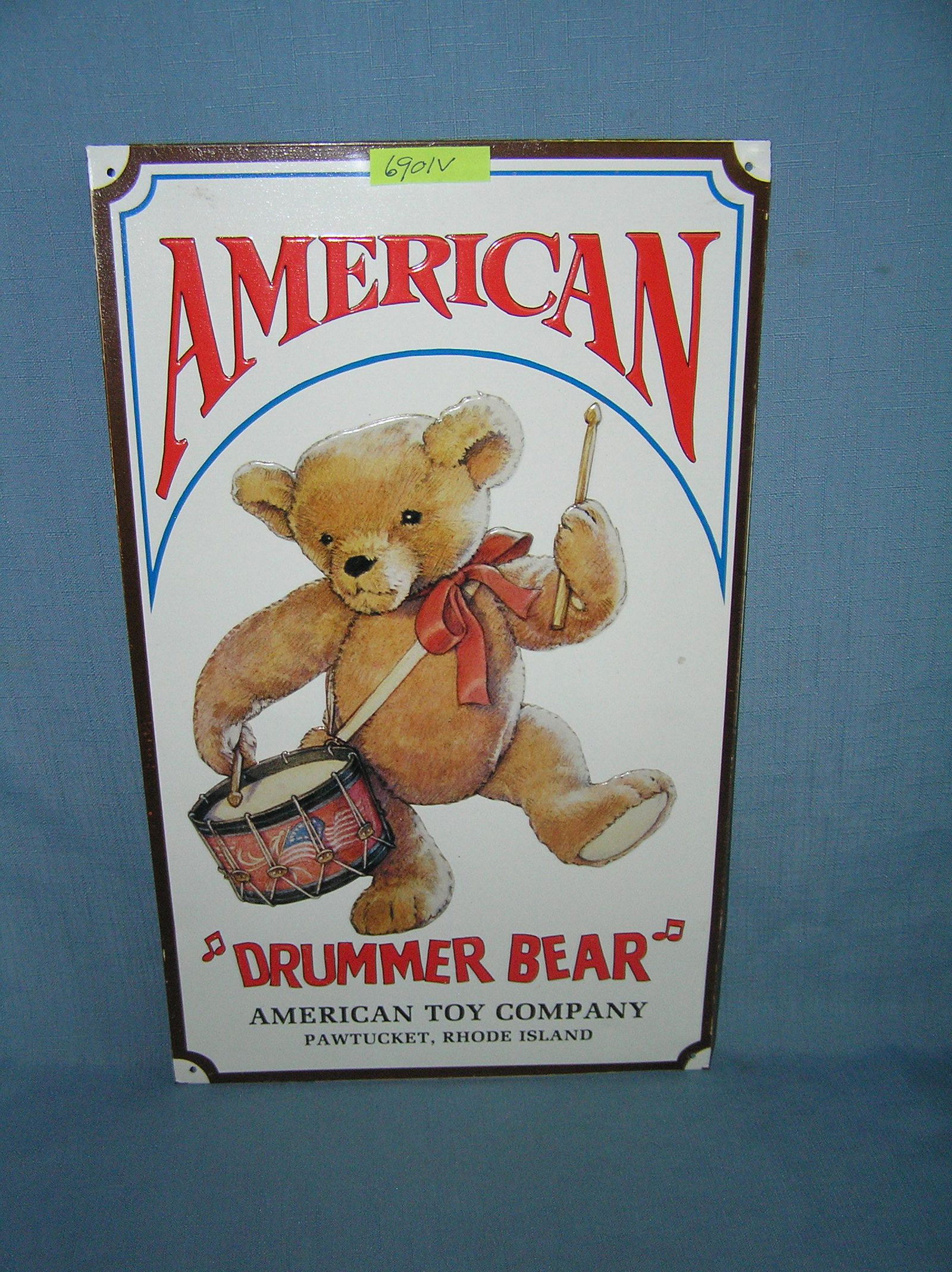 American Drummer bear teddy bear by the American Toy Company tin advertising sign: American Drummer bear teddy bear by the American Toy Company tin advertising sign 9 3/4 inches by 16 1/4 inches est. value $80.00-$100.00